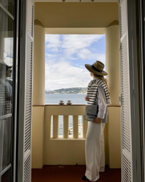 A cup of hot coffee, a view of the sea, and the sweetness of the morning